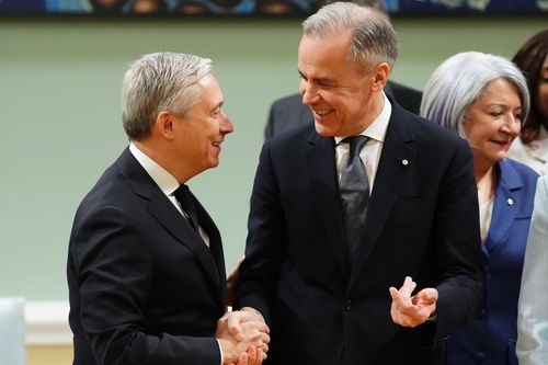 A shot taken in Rideau Hall in Ottawa of Mark Carney shaking hands with François-Philippe Champagne