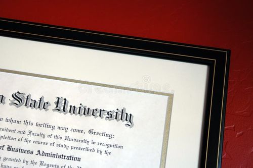 University Degree framed and hanging on red wall. Bachelors degree stock images, royalty-free photos and pictures