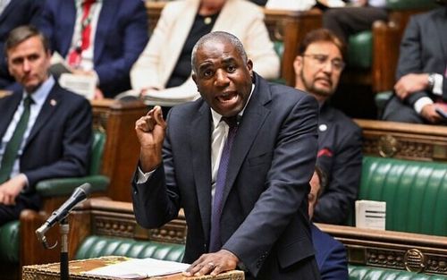arafed man in a suit and tie speaking in a parliament