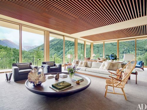 This image may contain Furniture Table Room Lobby Indoors Living Room Coffee Table Interior Design Chair and Couch