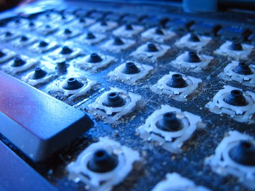 laptop keyboard with its keys removed for cleaning