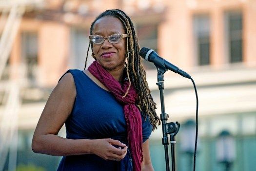 BART Commissioner Lateefah Simon addresses an audience gathered in response to the recent mass shooting in Buffalo, New York, where an 18 year-old man killed at least 10 people, mostly black, during a gathering and vigil in Oakland, CA on Wednesday, May 18, 2022. (Don Feria for Bay Area News Group)