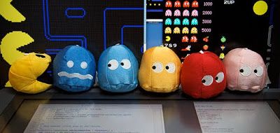 A photograph of stuffed toy PAC-MAN characters