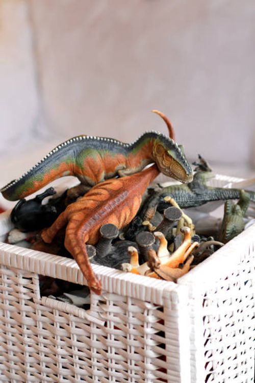 animal toys in toy box - dinosaur toys stock pictures, royalty-free photos & images