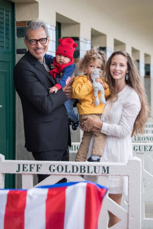Jeff Goldblum, his sons: River Joe and Charlie Ocean, and his wife Emilie Livingston pose in front of Goldblum's dedicated beach locker room on the...