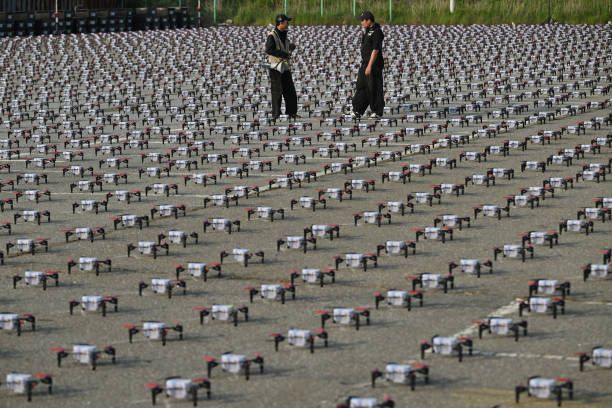Staff members check the drones before a drone light show as part of the 2024 Korea Drone Expo in Incheon on May 9, 2024.
