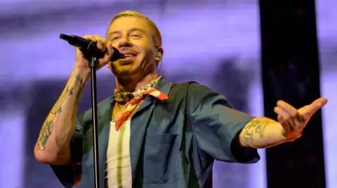 Getty Images Macklemore performs onstage during the ibis RockCorps France 2024 at Accor Arena on May 29, 2024 in Paris, France.