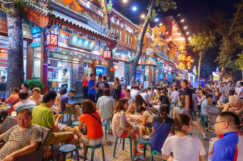 Guijie Street in Beijing, China Beijing, China - June 28, 2014: Crowds gather Guijie Street. The street is a popular nightlife destination. beijing stock pictures, royalty-free photos & images