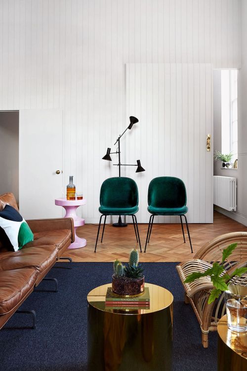 Image may contain Living Room Room Indoors Furniture Chair Interior Design Table Couch and Coffee Table