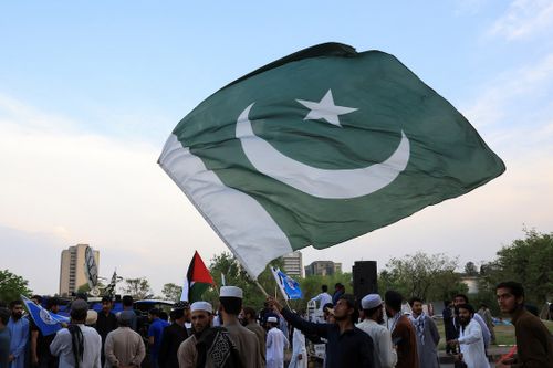 araffes holding a flag and a flag of pakistan