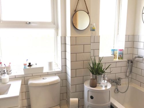 White Bathroom with Metro Tiles and Grey Grout