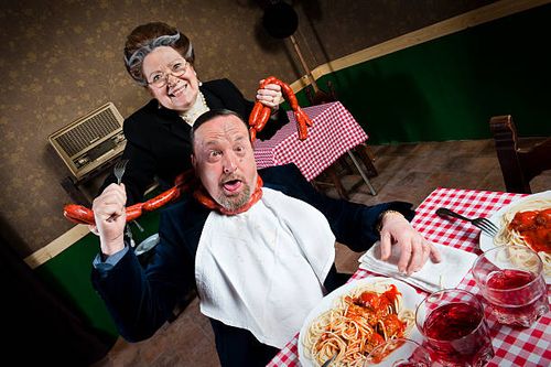 man strangled by his wife - man eating sausages stock pictures, royalty-free photos & images