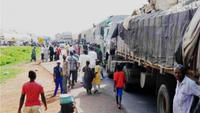 Hardship: Residents overpower truck driver; loot rice, beans, garri branded in Tinubu's name in Ondo