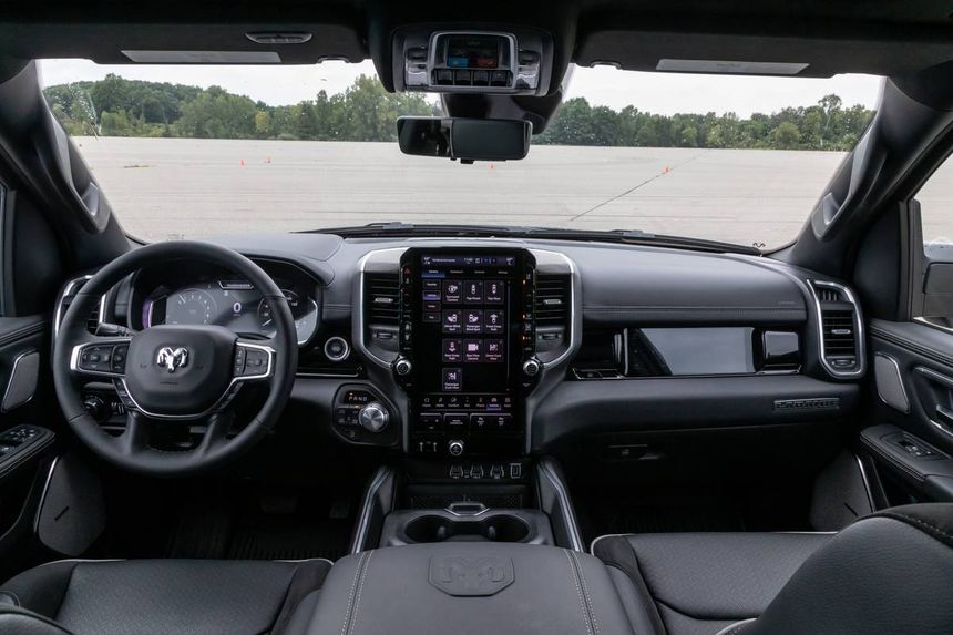 Ram 1500 interior featuring large Uconnect touchscreen infotainment system and modern dashboard layout