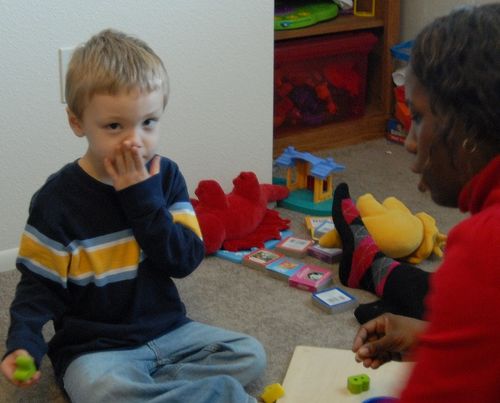 autistic boy receiving aba therapy