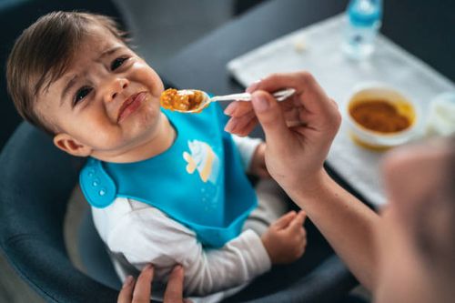 trying to feed a baby boy - person refusing food stock pictures, royalty-free photos & images
