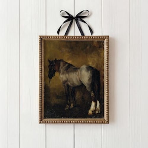 May include: An antique framed painting of a horse, with a black bridle and a dark background. The horse is gray and white, with a brown mane. The frame is gold, and a black ribbon is tied at the top.