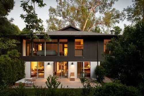 Mid-Century Modern Family Home Exterior. Mid-Century Pavilion by Breland-Harper.