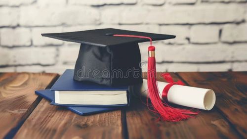 A graduation cap and diploma rest on top of a book. image. Bachelor s degree stock images, royalty-free photos and pictures