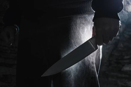 Dark photo of a man holding a big knife, crime concept. Dark photo of a man holding a big knife, crime concept. stabbing stock pictures, royalty-free photos & images