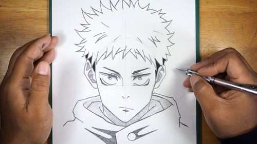 someone is drawing an anime character with pencils on the paper that they are holding