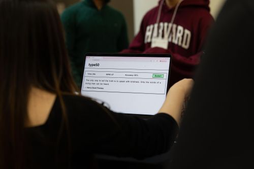 Student presents their CS50 final project, type50, at the CS50 Fair, an end-of-semester event where projects are demonstrated to the Harvard community.