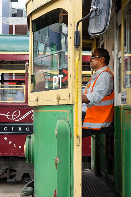 Australia, Victoria Melbourne Docklands Drive Yarra Trams tram trolley tramway public transportation City Circle Route Asian man driver engineer...