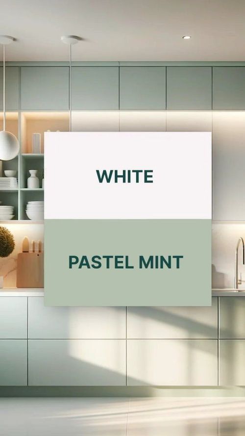 a kitchen with white cabinets and pastel mint green paint